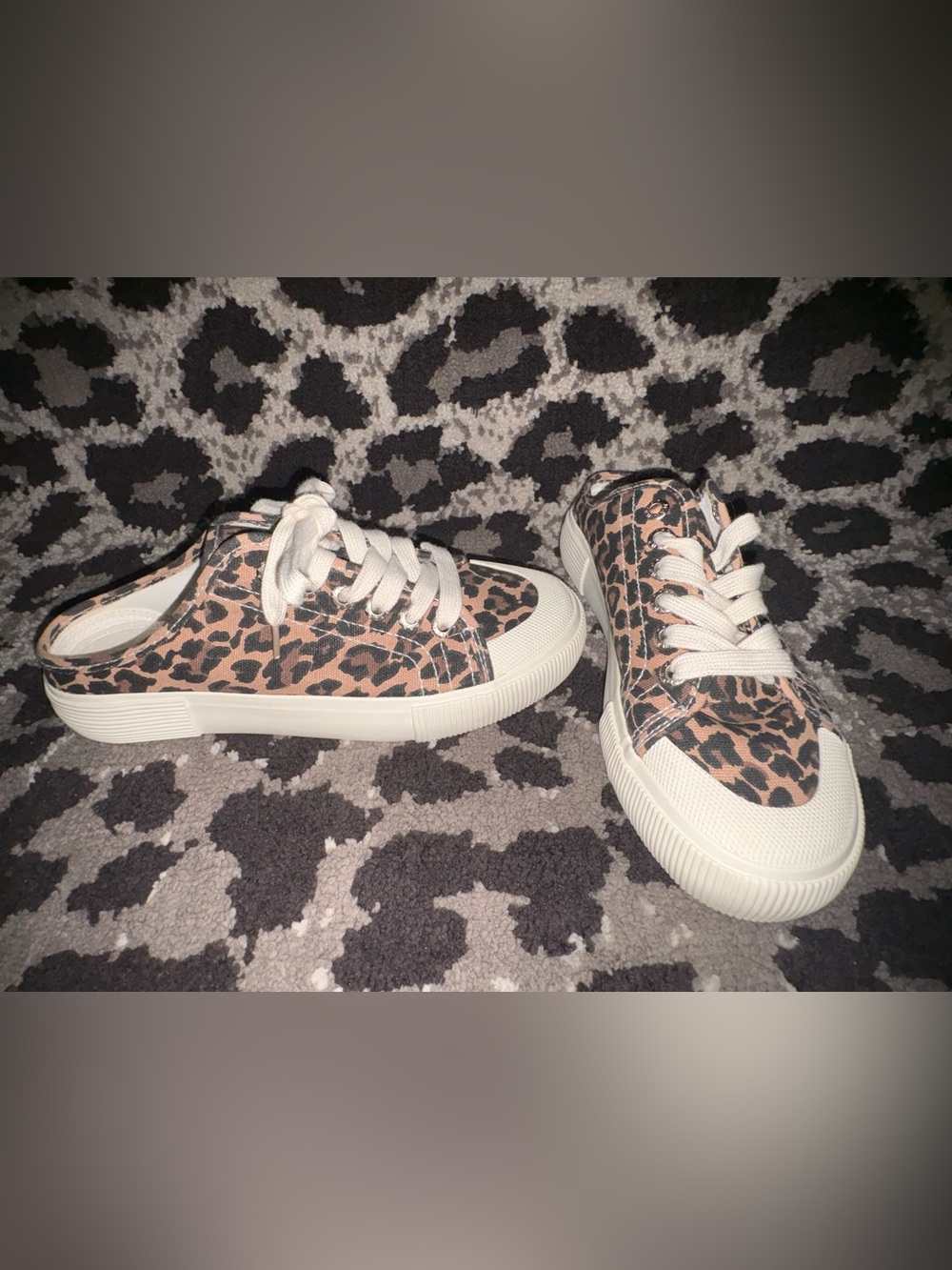 Leopard slip on sneakers.